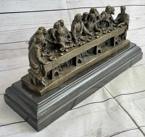 Detailed bronze sculpture of The Last Supper showcasing religious symbolism through expressive, intricate figures.