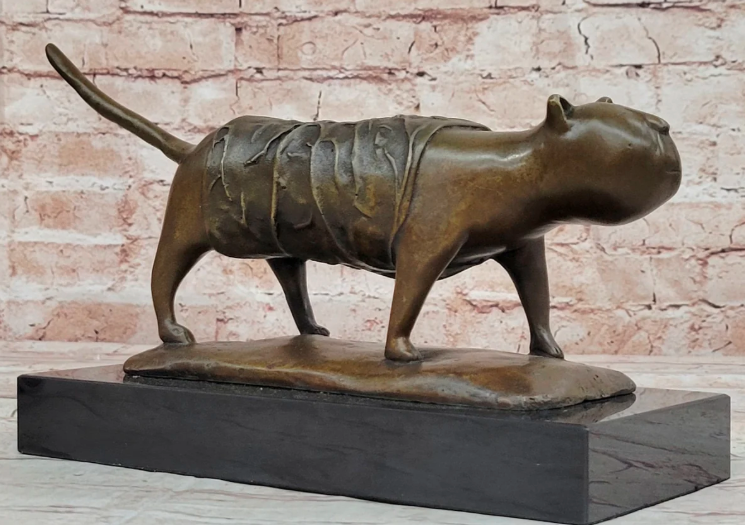 Bronze sculpture of a standing cat-like animal with textured body on a rectangular base