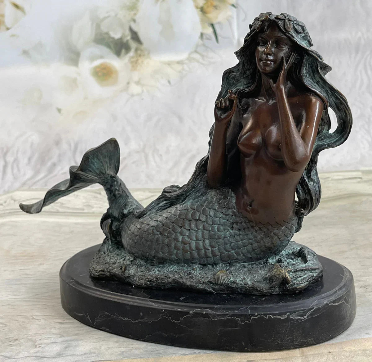 bronze mermaid statue