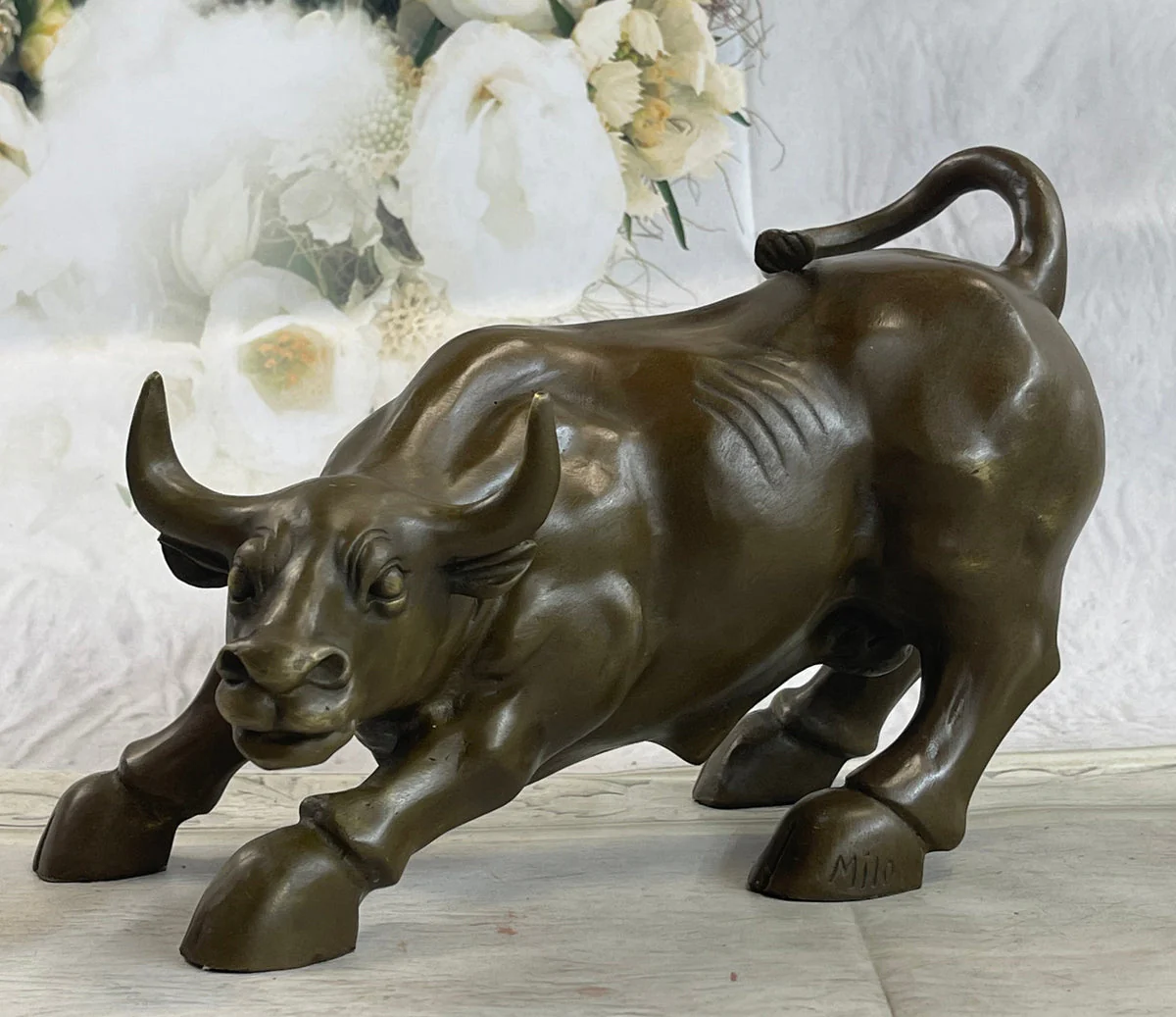 Legendary bronze bull sculpture titled “Marching into the Annals of Time
