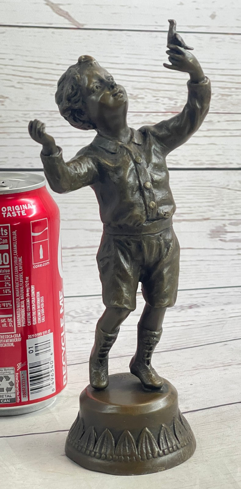 Milo`s Artistry: Intricate Bronze Statue of a Boy Holding a Bird - Handmade by Miguel Lopez