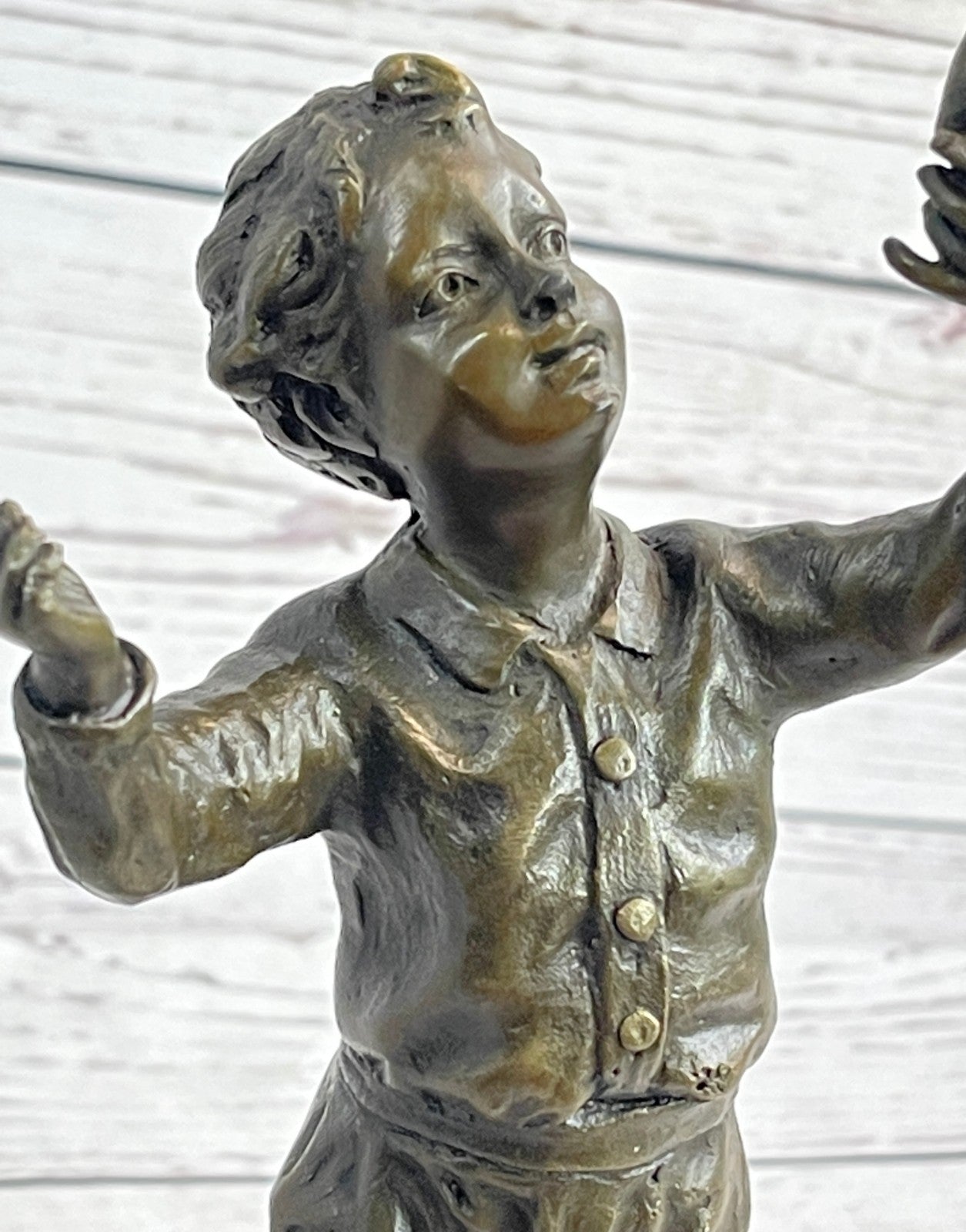 Milo`s Artistry: Intricate Bronze Statue of a Boy Holding a Bird - Handmade by Miguel Lopez