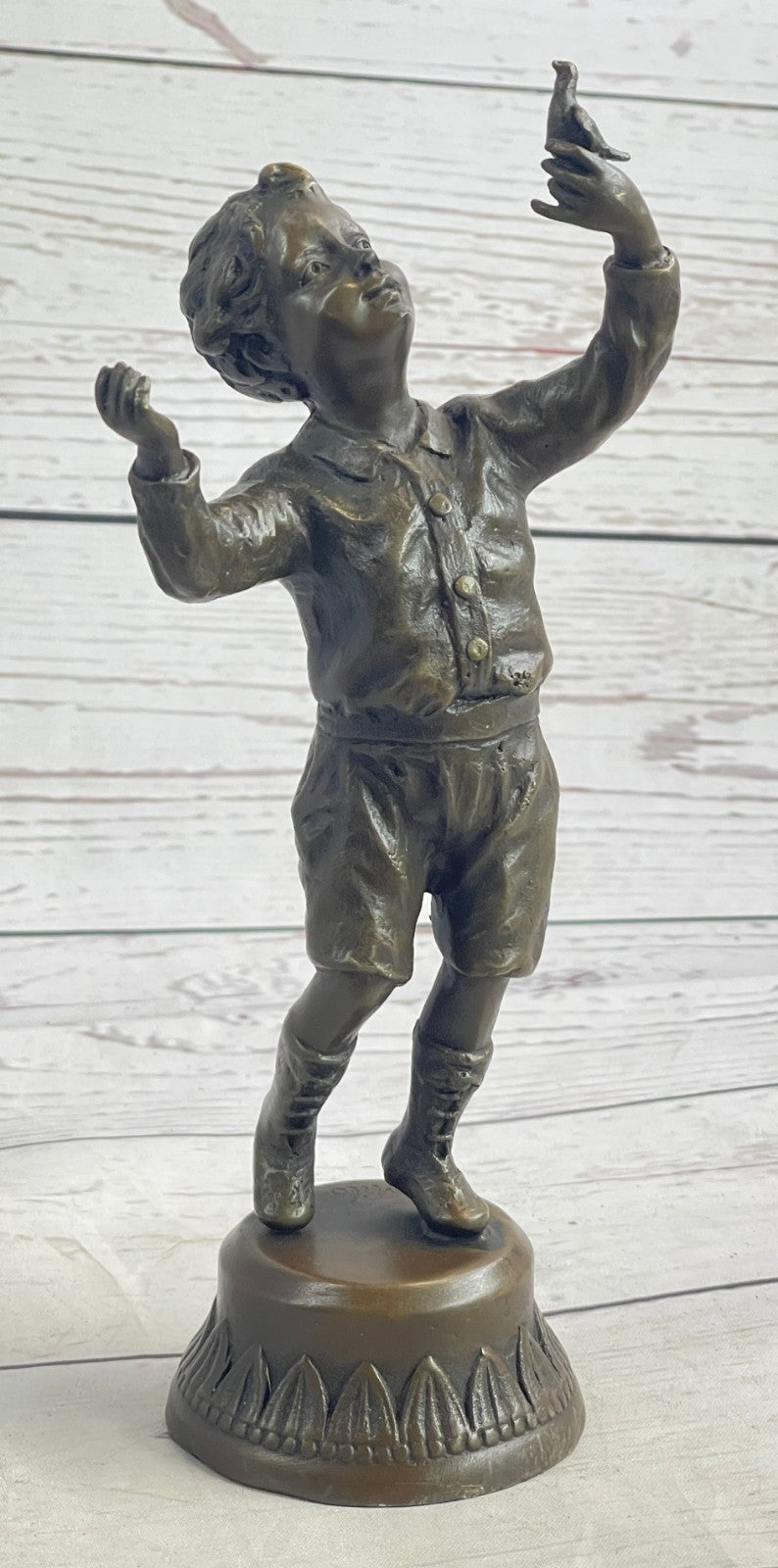 Milo`s Artistry: Intricate Bronze Statue of a Boy Holding a Bird - Handmade by Miguel Lopez