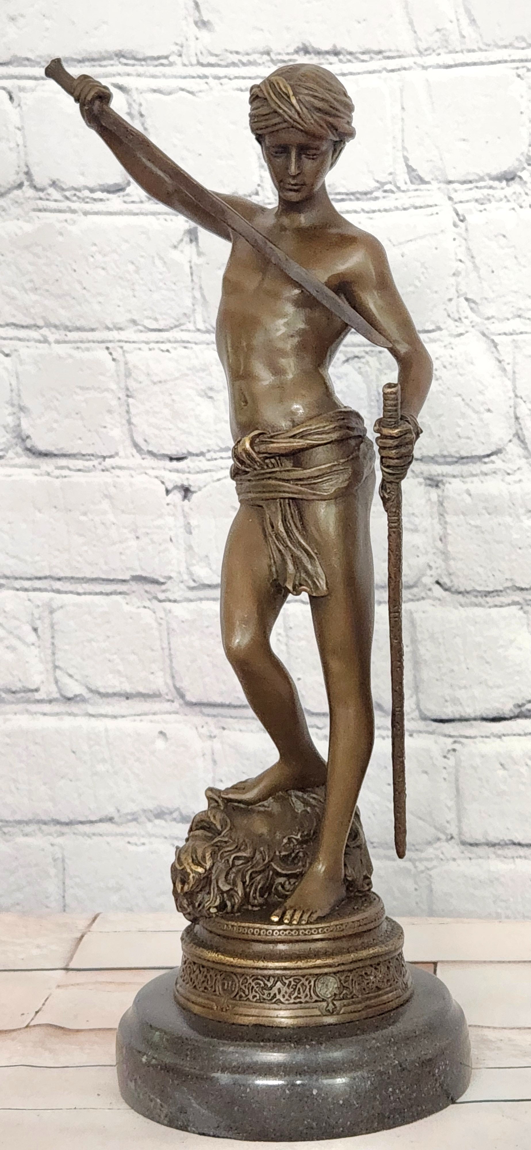 Turn of century bronze statue representing David and Goliath. Signed "A. Mercie