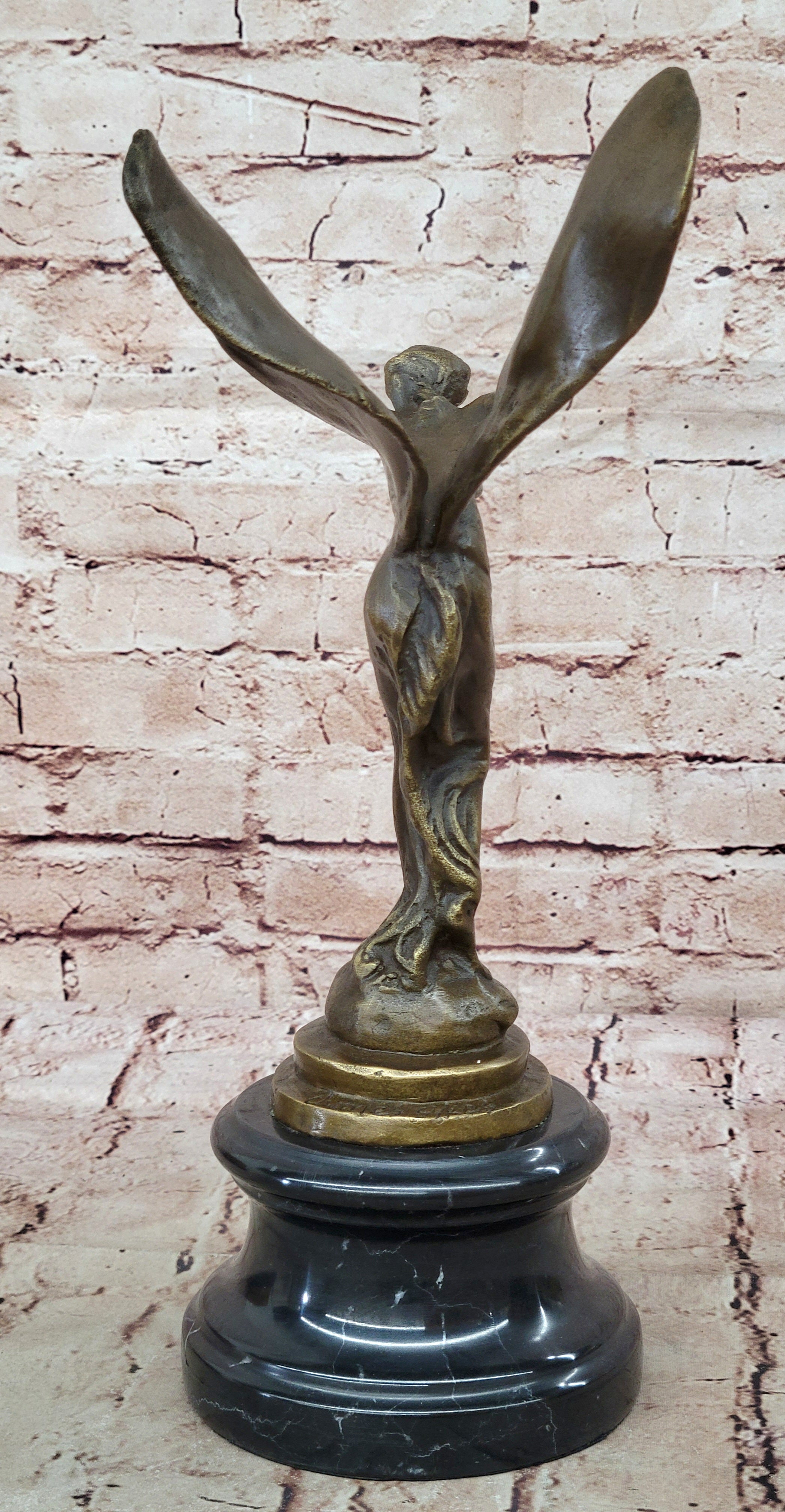 Spirit of Ecstasy Large bronze with brown patina mounted on dark marble base