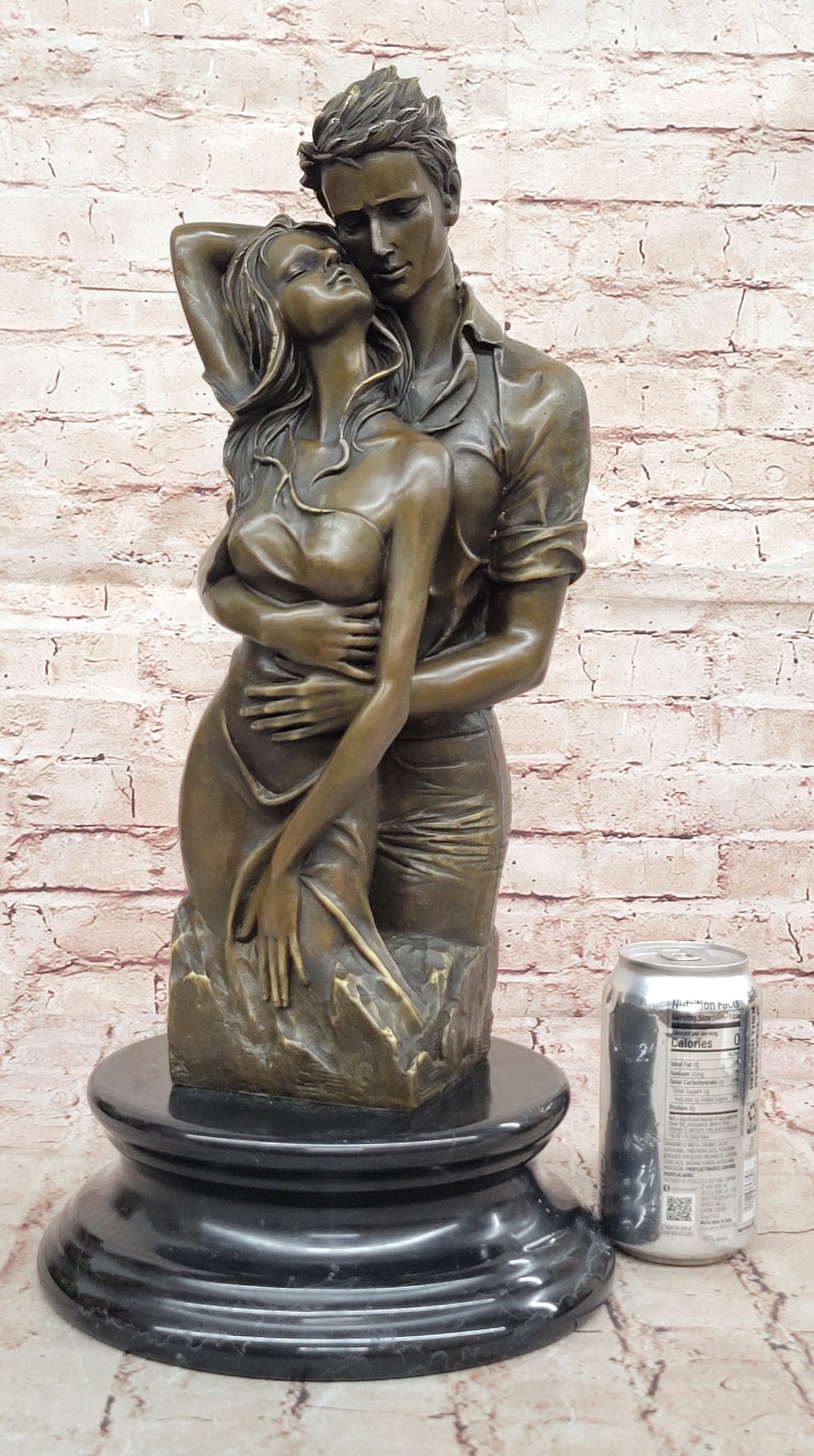 Bronze sculpture of a couple`s tender embrace portrays the power of intimacy