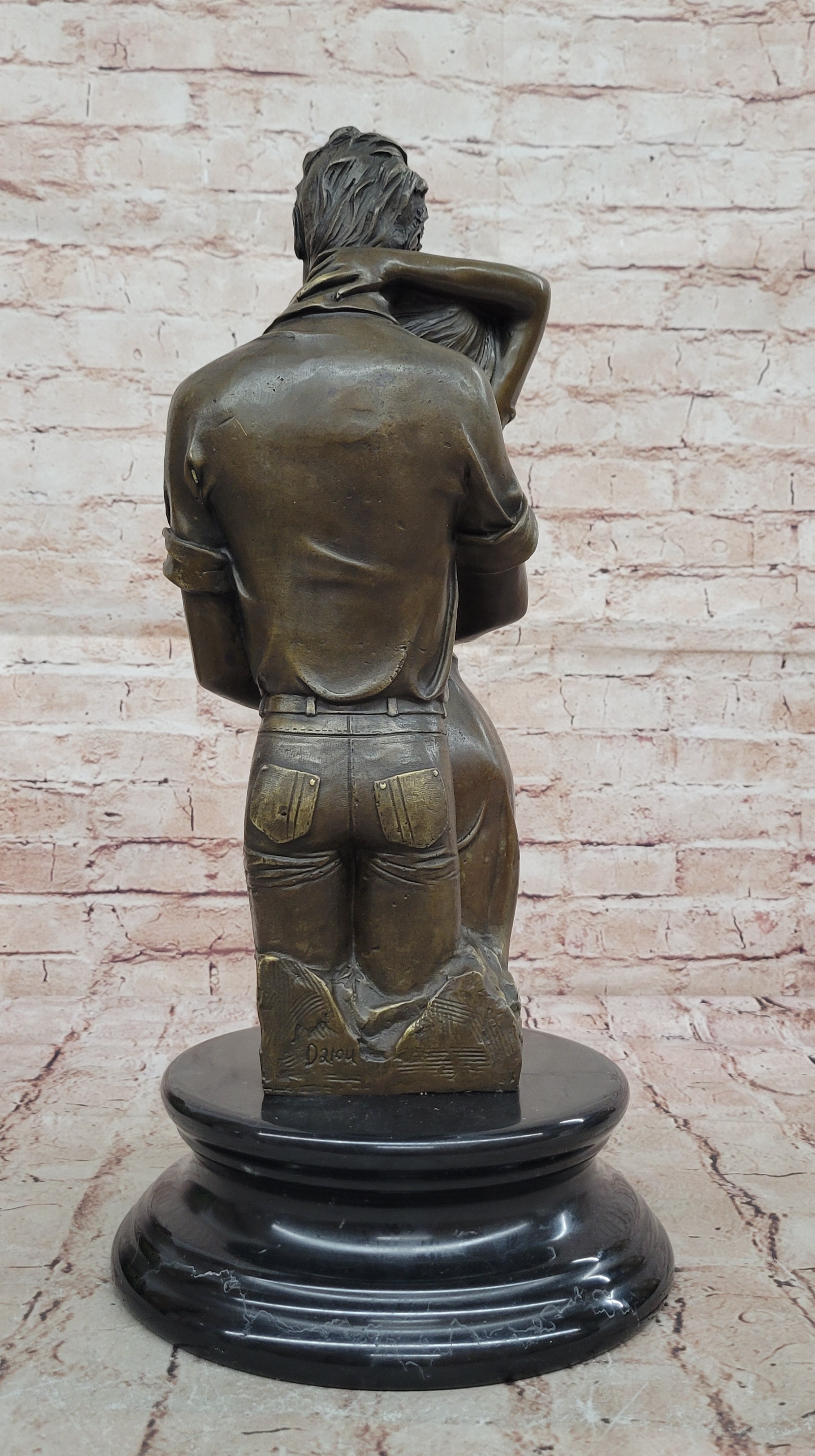 Bronze sculpture of a couple`s tender embrace portrays the power of intimacy