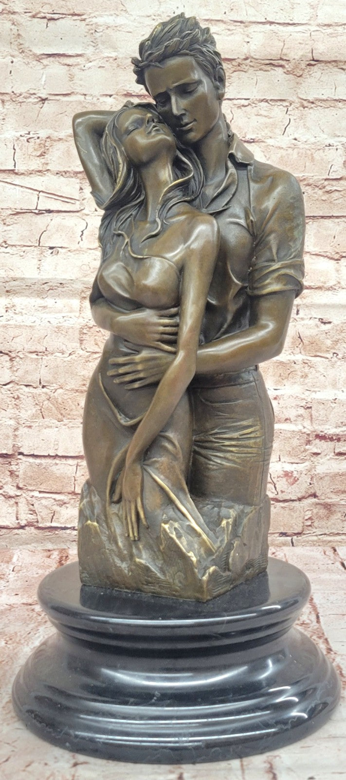 Bronze sculpture of a couple`s tender embrace portrays the power of intimacy