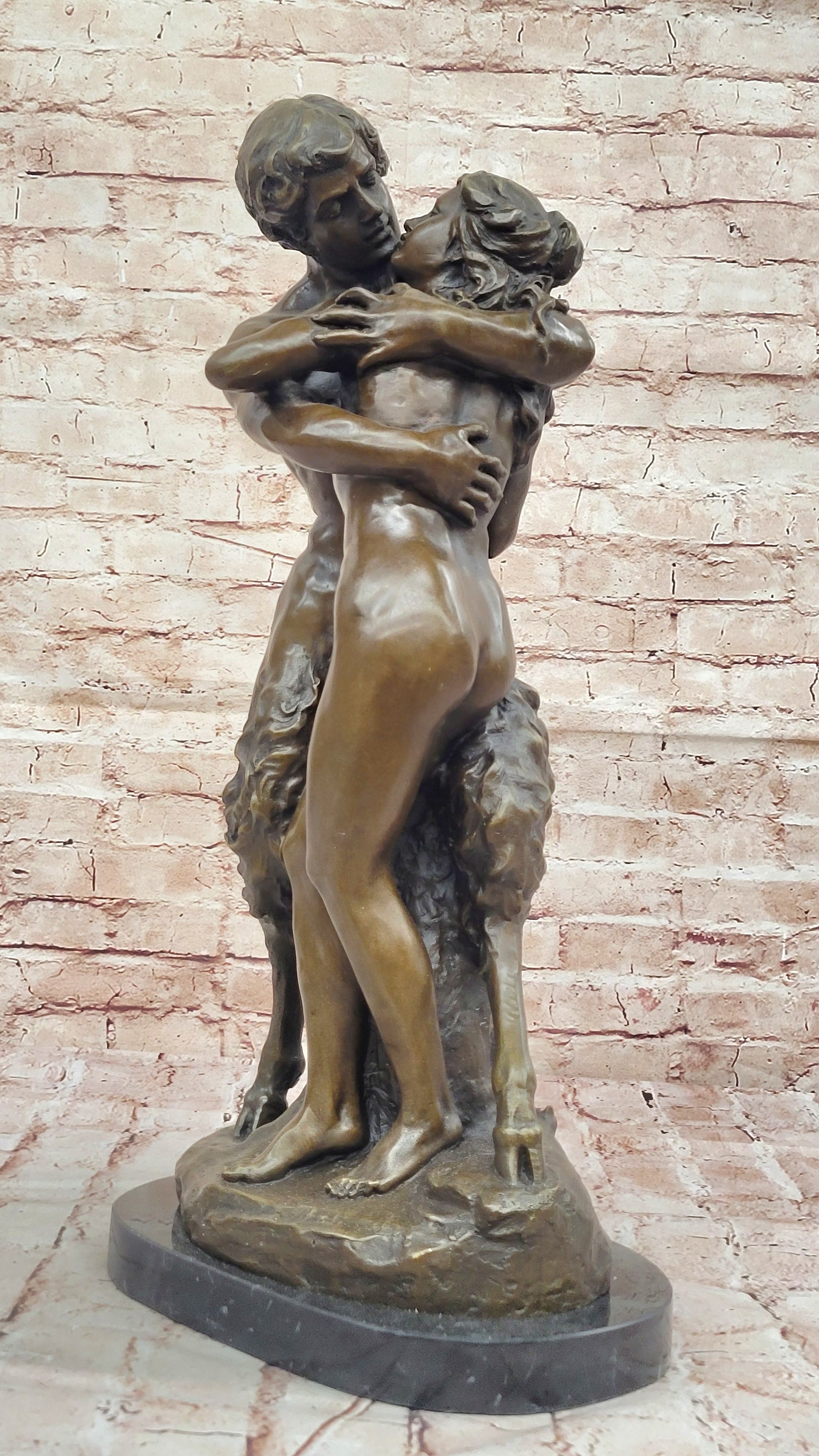 Greek God Pan Faun charms his way in the Arms of a Nude Woman Bronze Statue