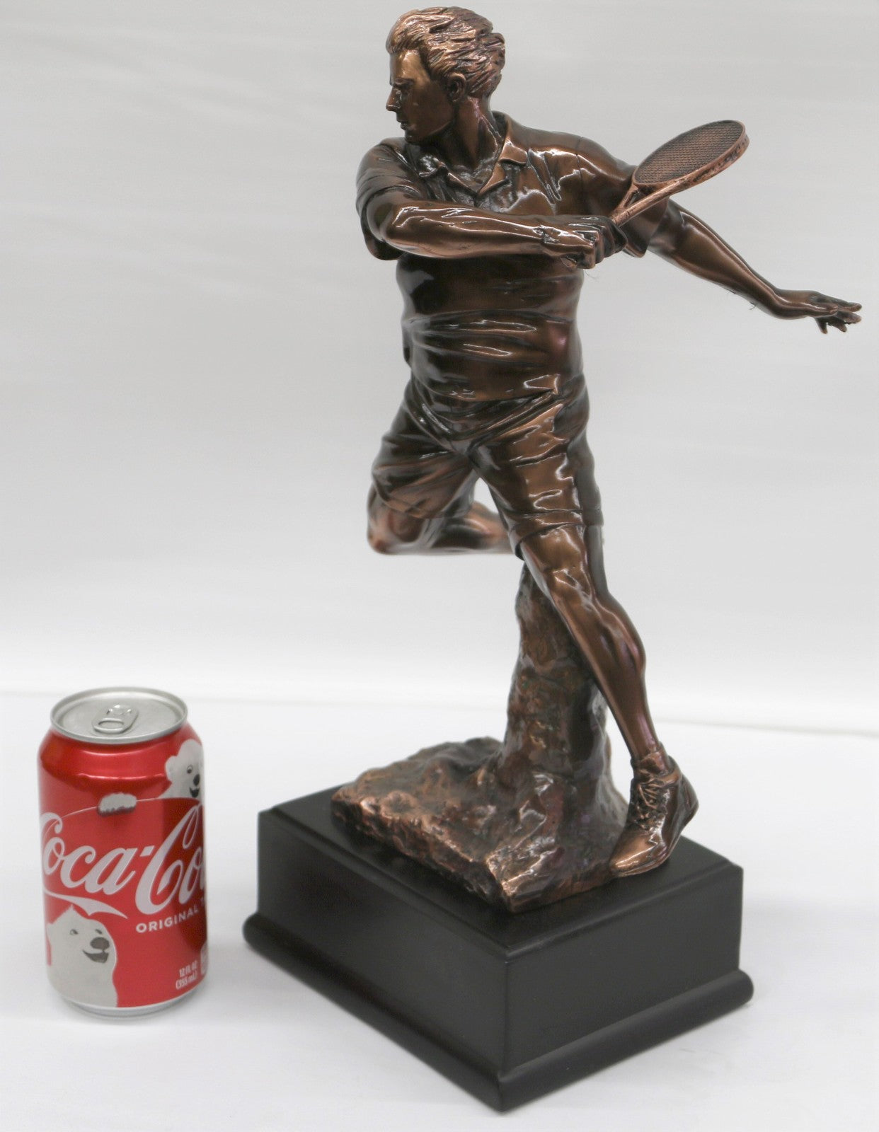 The Male Tennis player depicted wearing sporty gear and chunky Shoes