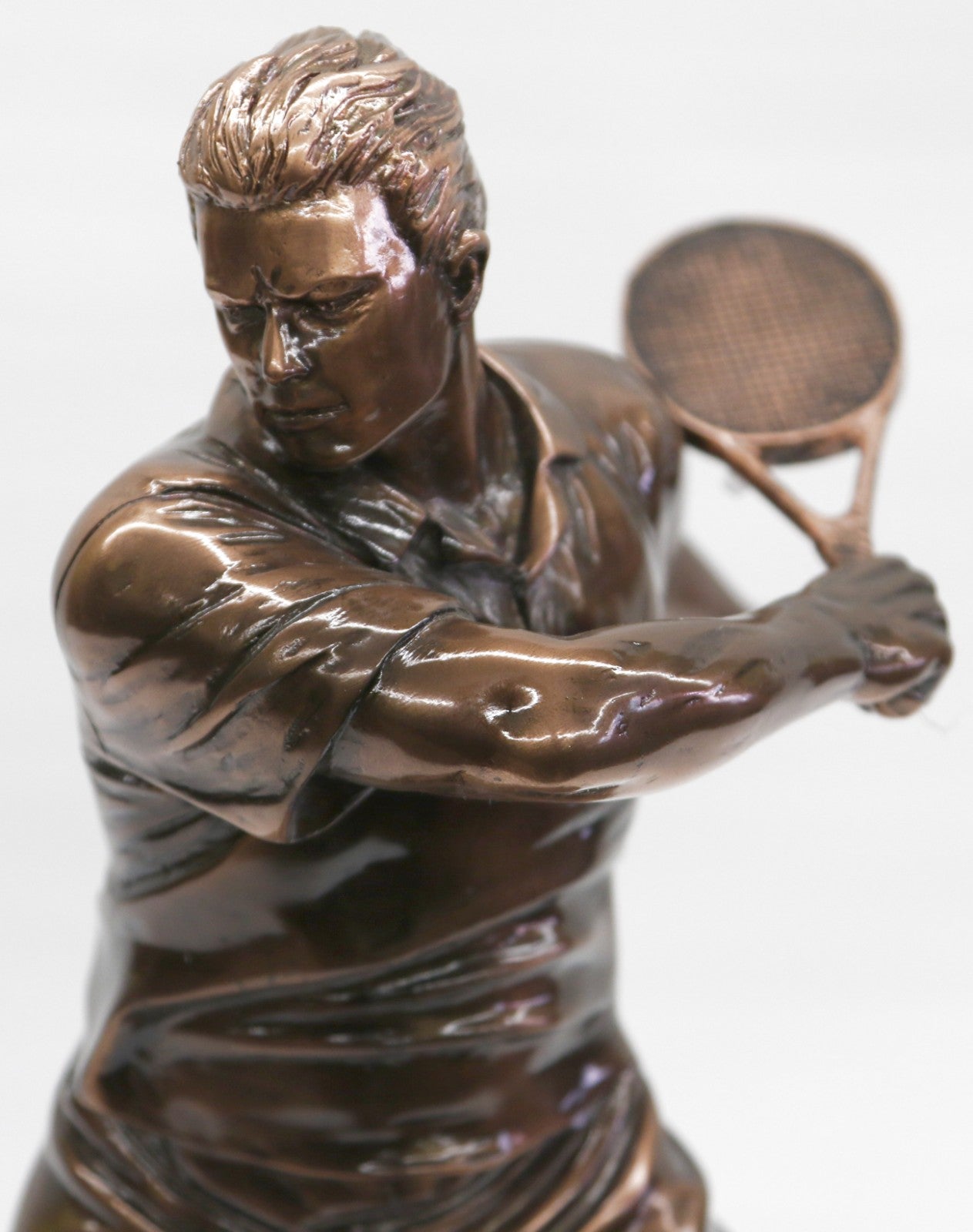 The Male Tennis player depicted wearing sporty gear and chunky Shoes