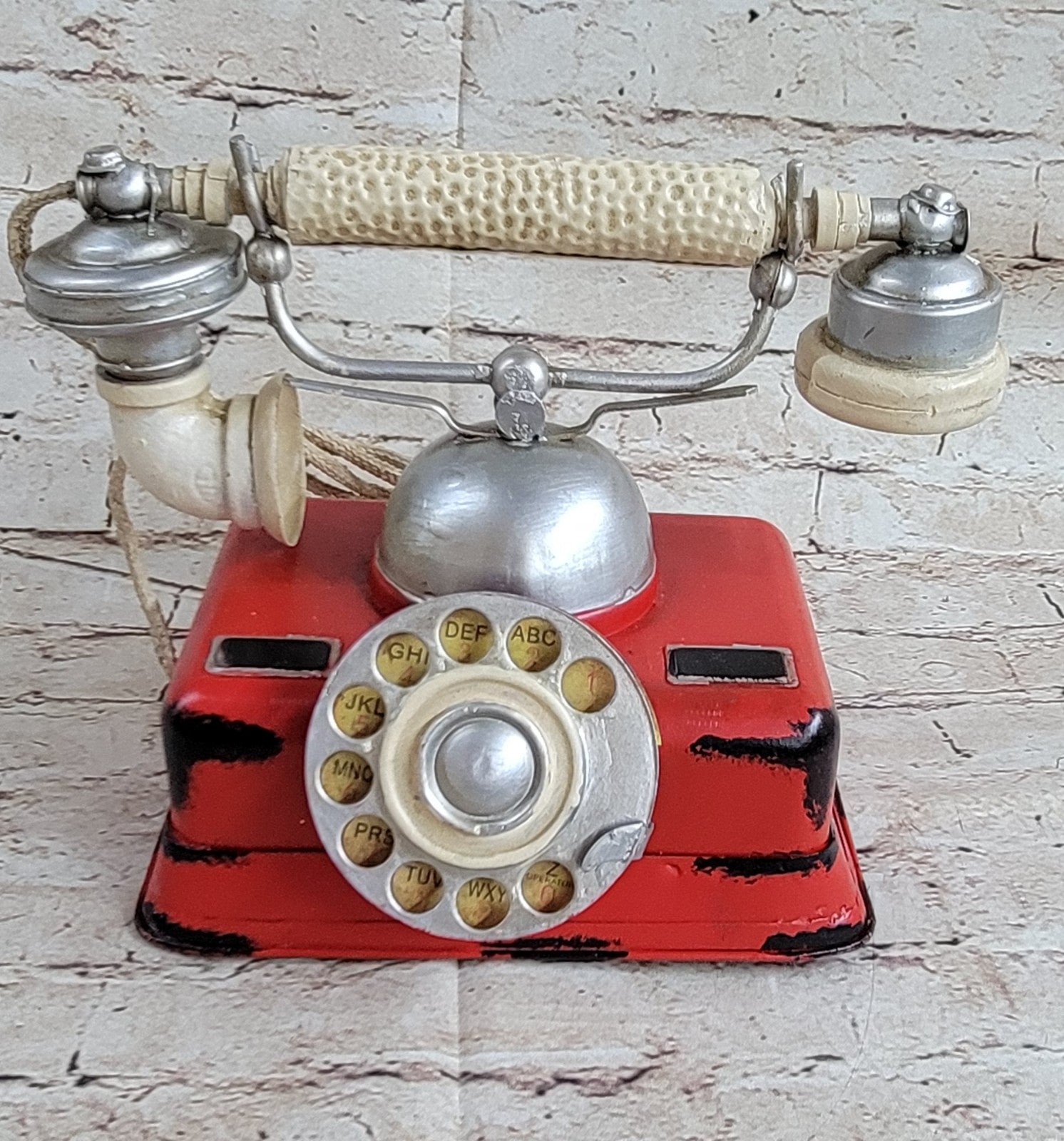 "Decorate for any table, desk, or shelf in sporty fashion with Our Rustic Red German Rotary Dial Phone..."