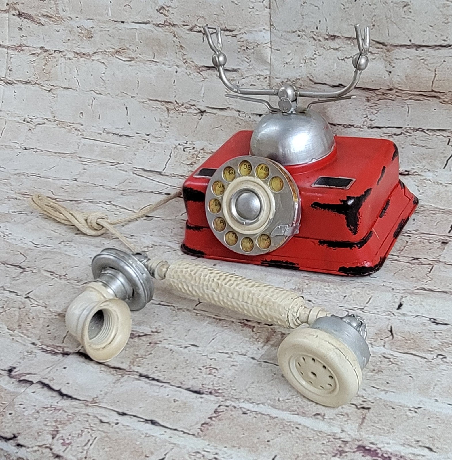 "Decorate for any table, desk, or shelf in sporty fashion with Our Rustic Red German Rotary Dial Phone..."