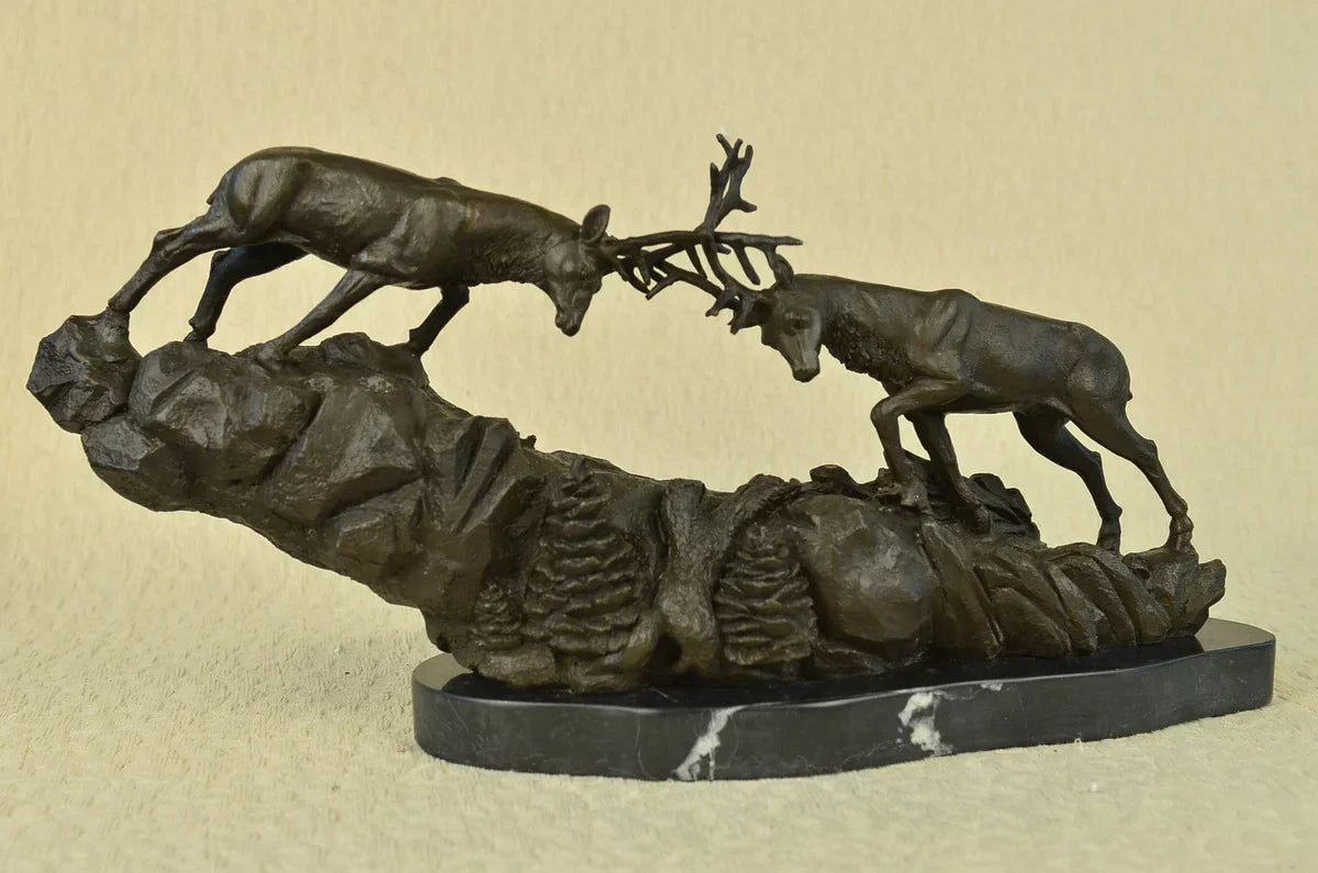 Bronze sculpture of two stags fighting, dynamic wildlife figurine capturing motion and power in handcrafted detail 