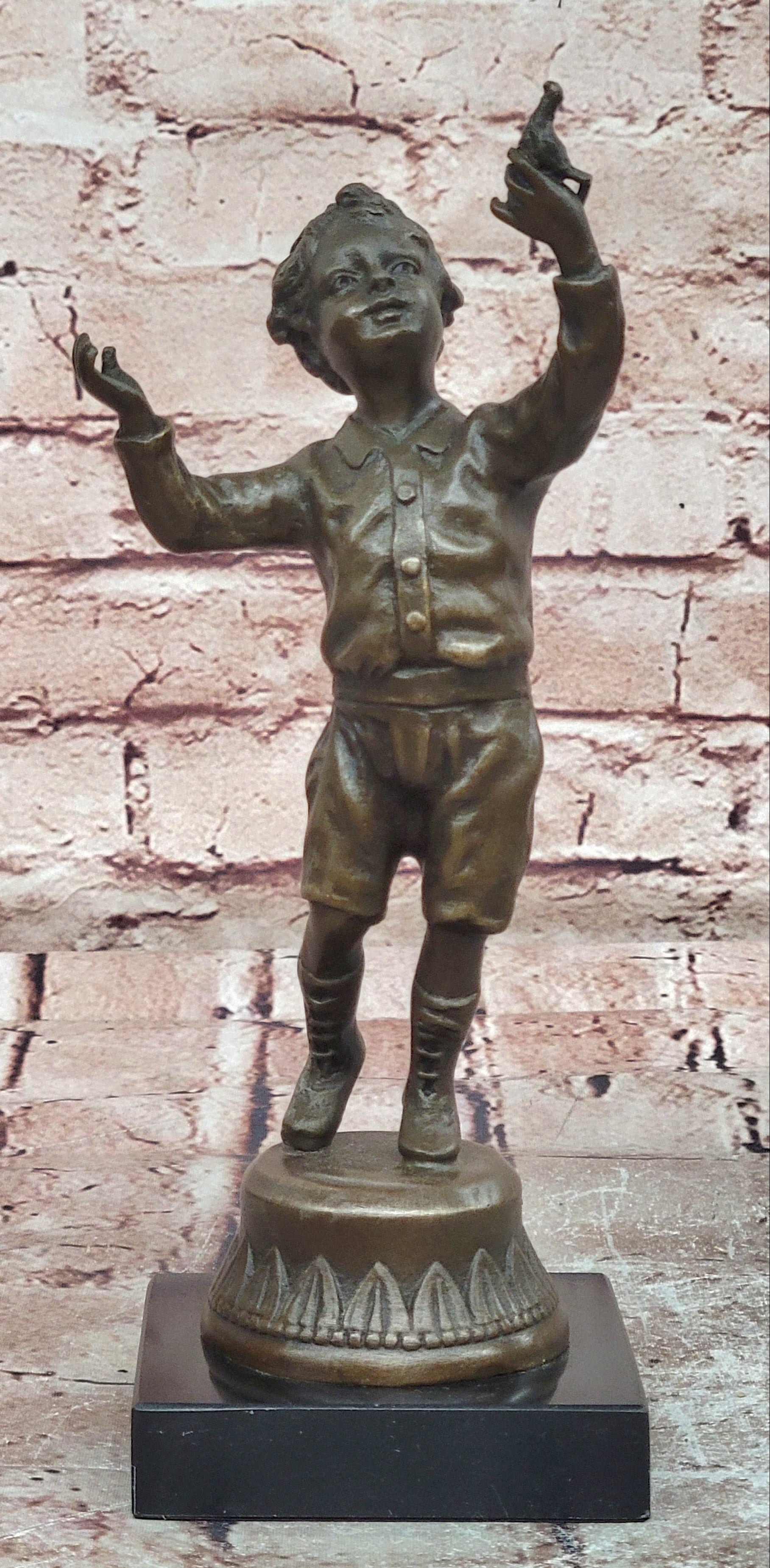 Milo`s Artistry: Intricate Bronze Statue of a Boy Holding a Bird - Handmade by Miguel Lopez