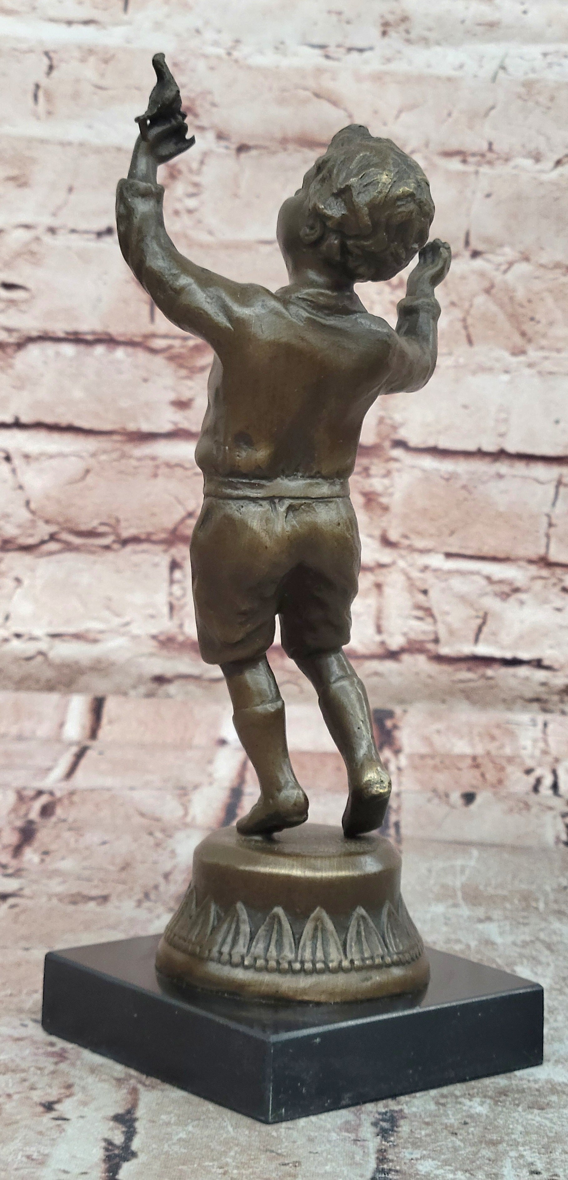 Milo`s Artistry: Intricate Bronze Statue of a Boy Holding a Bird - Handmade by Miguel Lopez