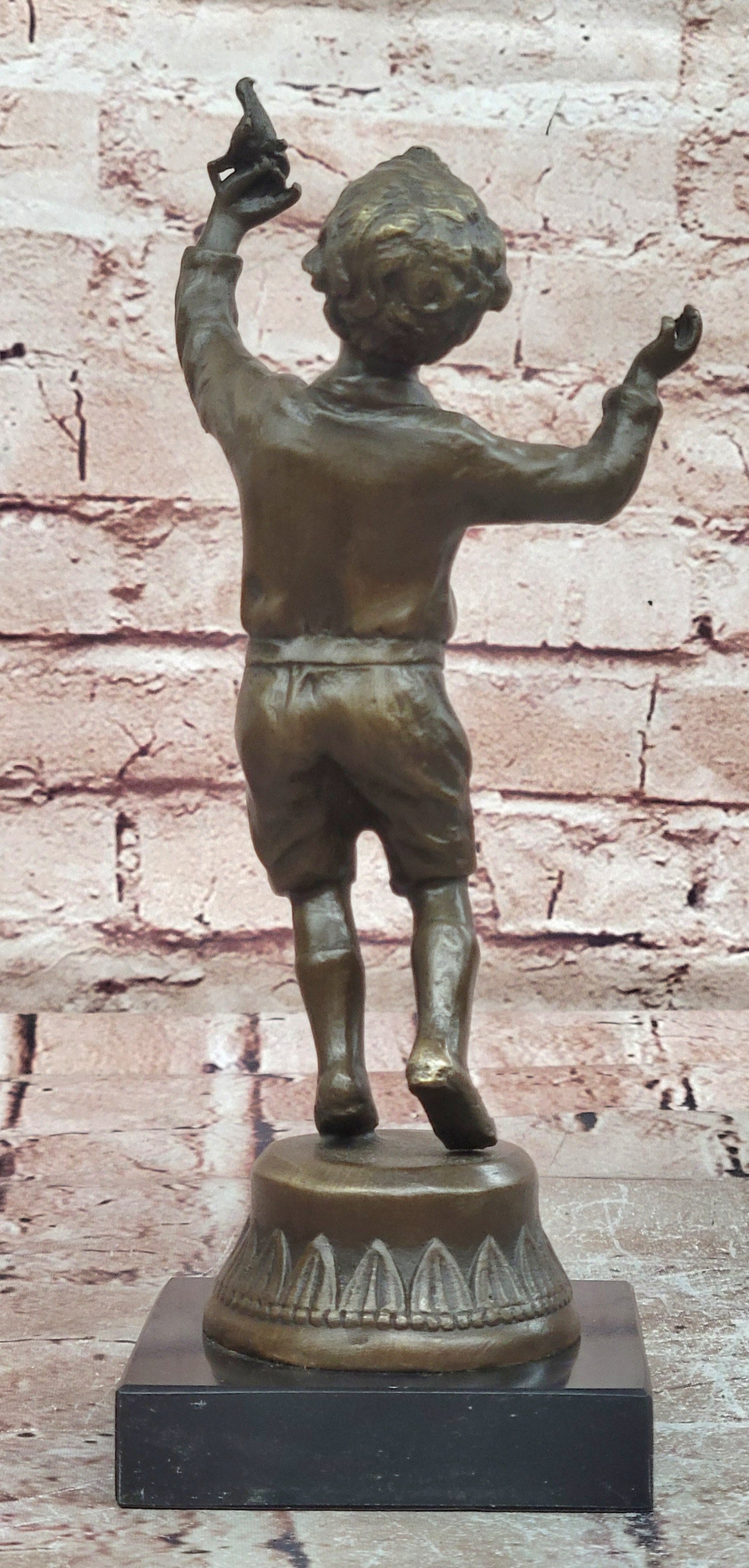 Milo`s Artistry: Intricate Bronze Statue of a Boy Holding a Bird - Handmade by Miguel Lopez