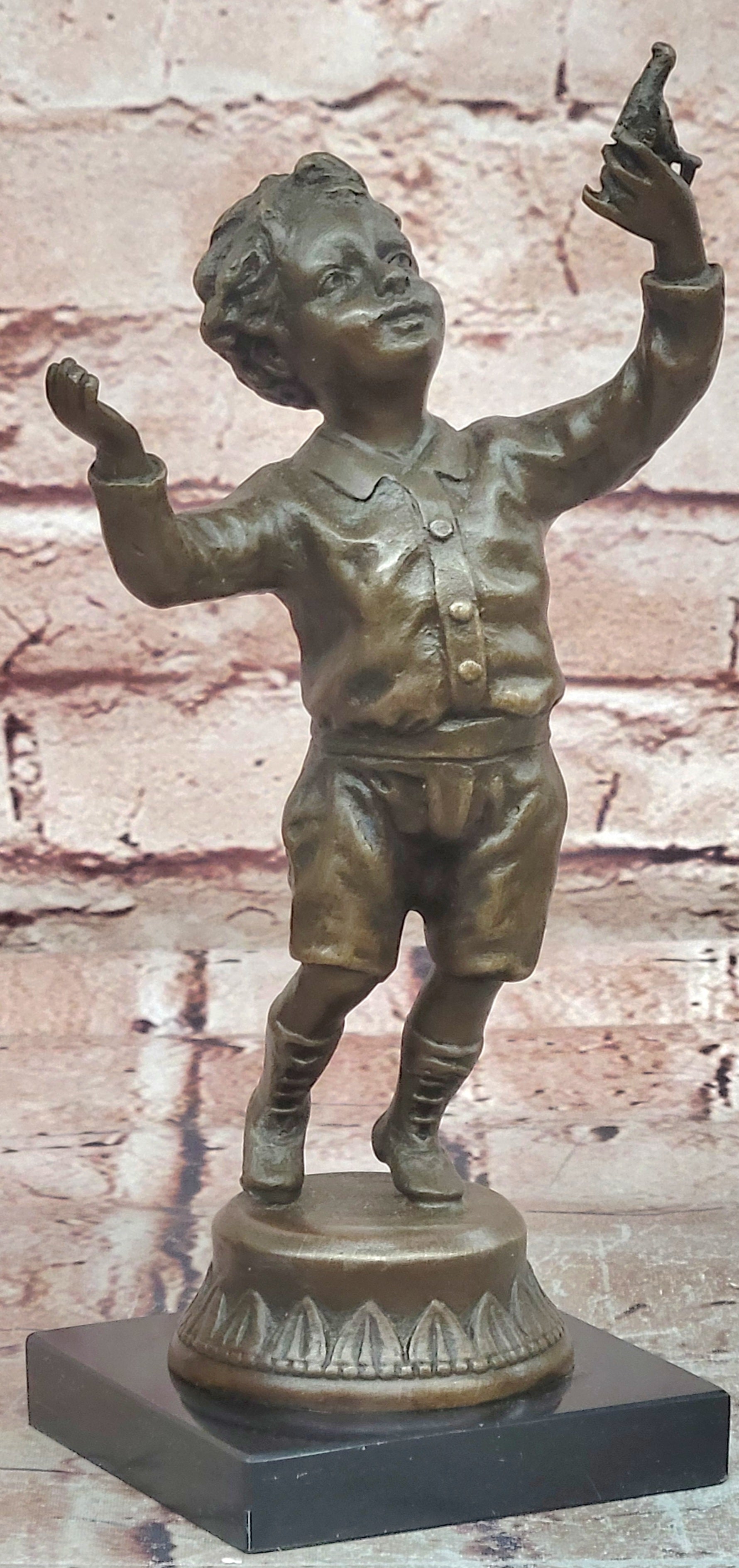 Milo`s Artistry: Intricate Bronze Statue of a Boy Holding a Bird - Handmade by Miguel Lopez