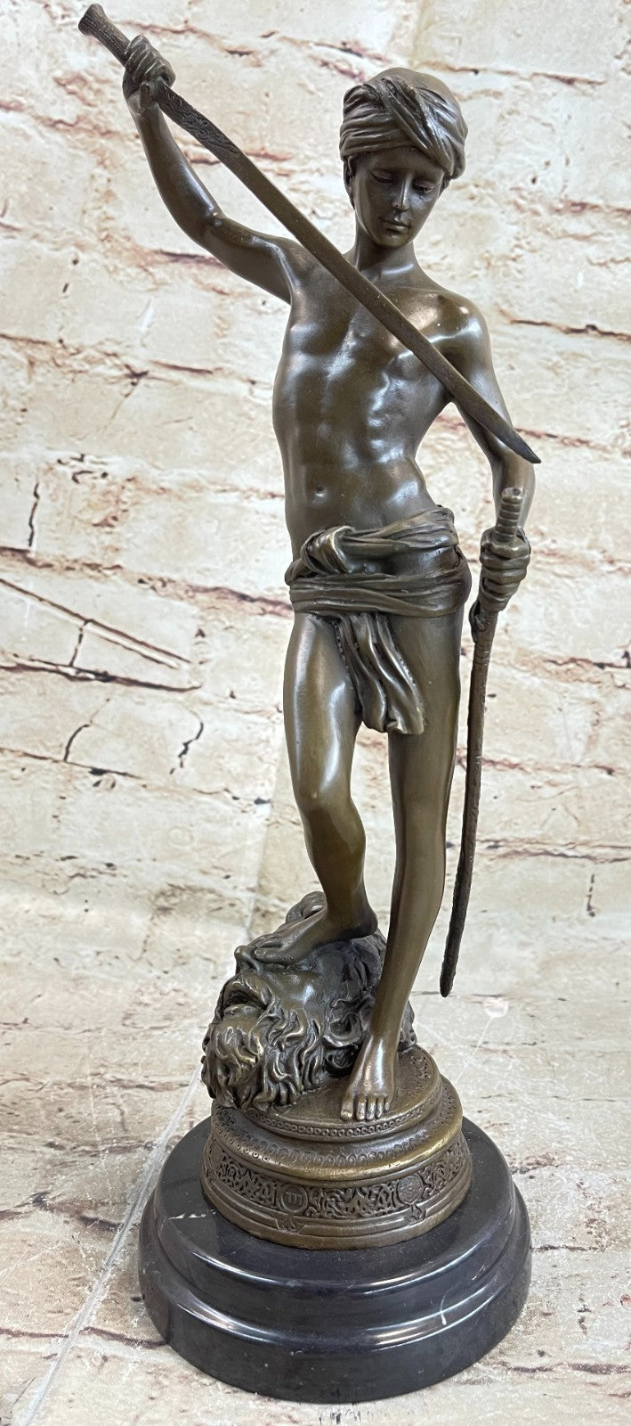 Turn of century bronze statue representing David and Goliath. Signed "A. Mercie
