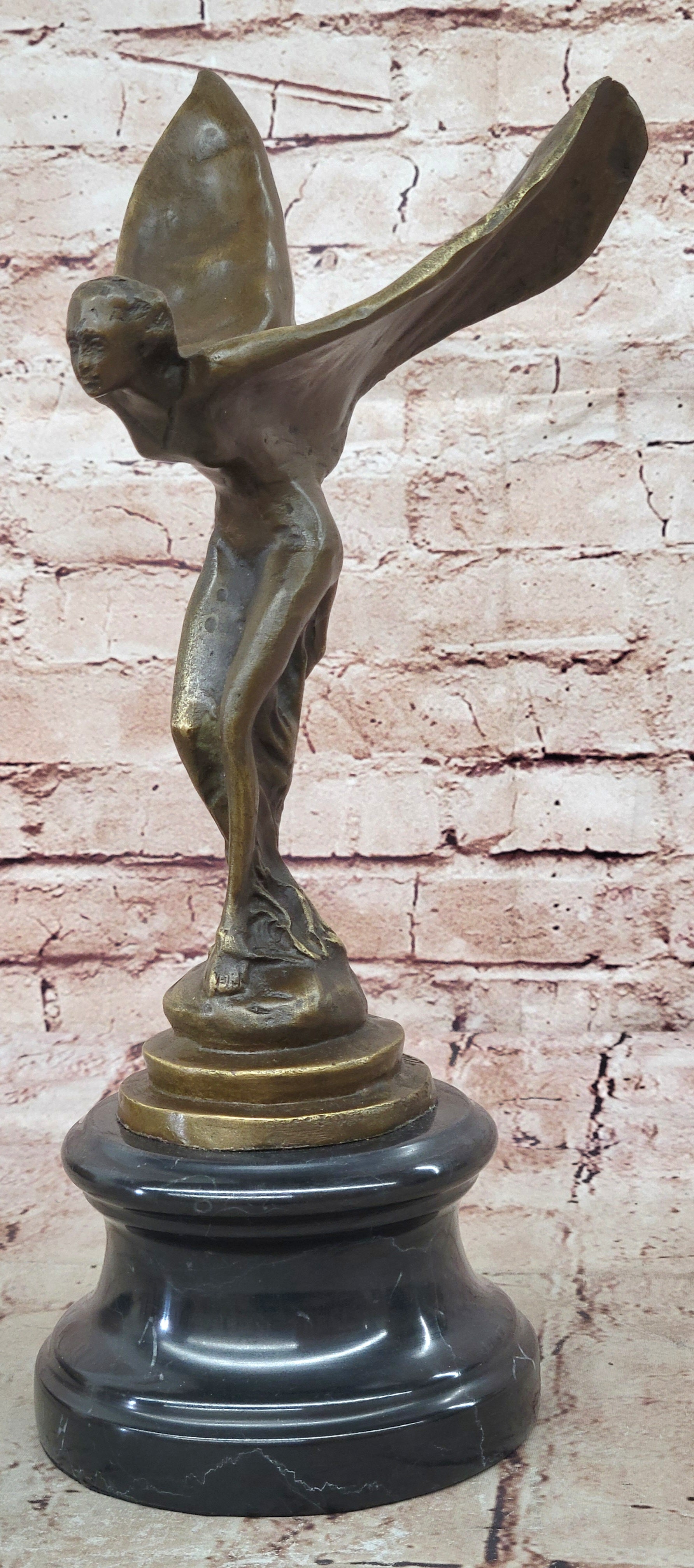 Spirit of Ecstasy Large bronze with brown patina mounted on dark marble base