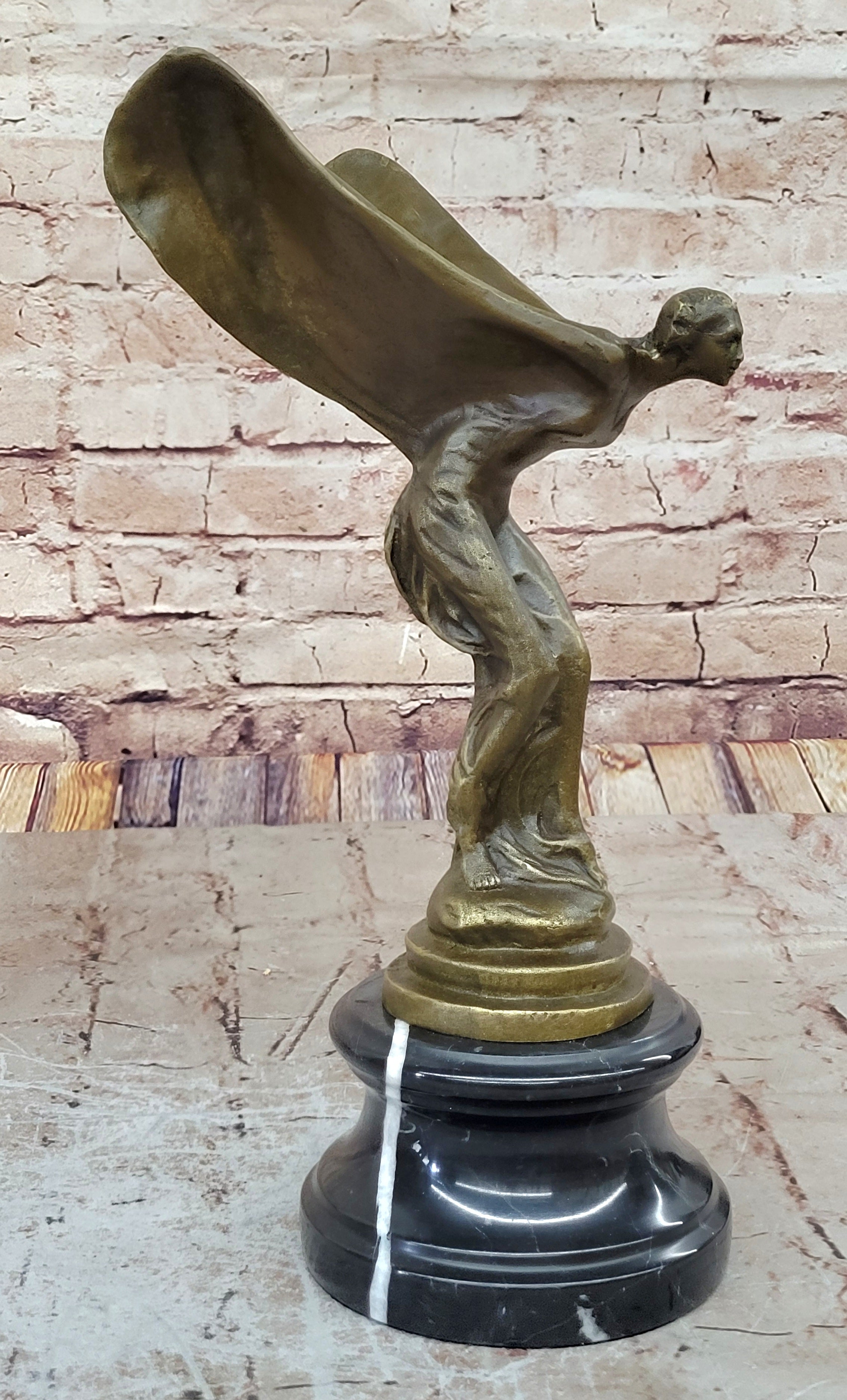 Spirit of Ecstasy Large bronze with brown patina mounted on dark marble base