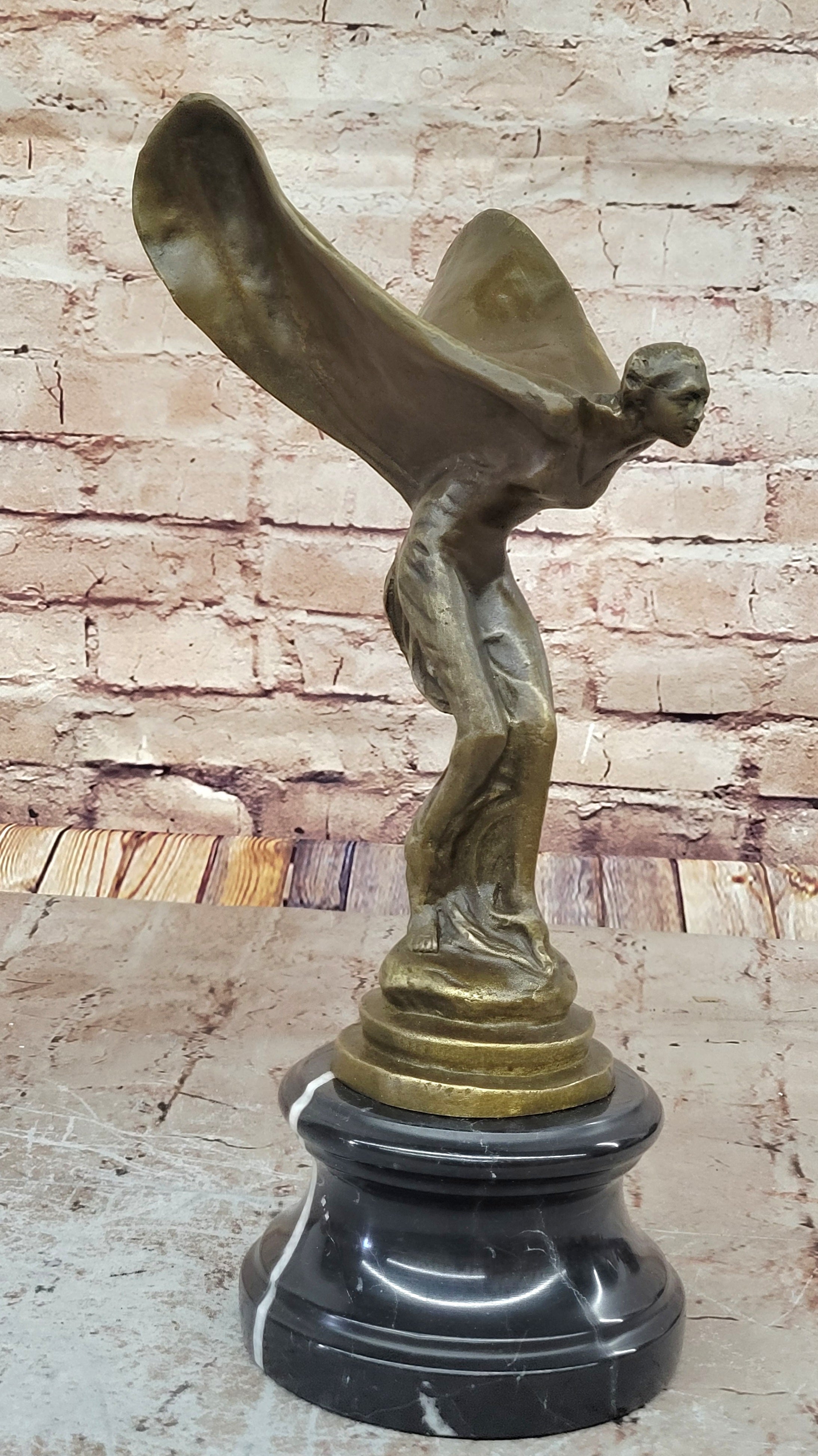 Spirit of Ecstasy Large bronze with brown patina mounted on dark marble base