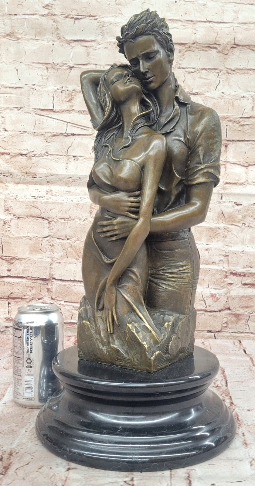 Bronze sculpture of a couple`s tender embrace portrays the power of intimacy
