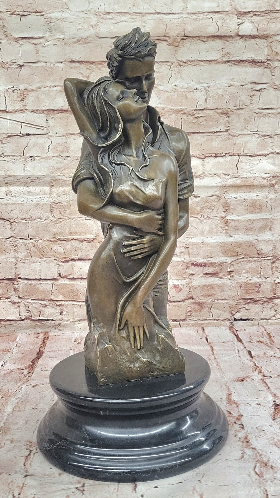Bronze sculpture of a couple`s tender embrace portrays the power of intimacy