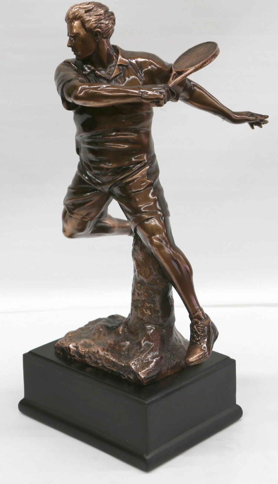 The Male Tennis player depicted wearing sporty gear and chunky Shoes