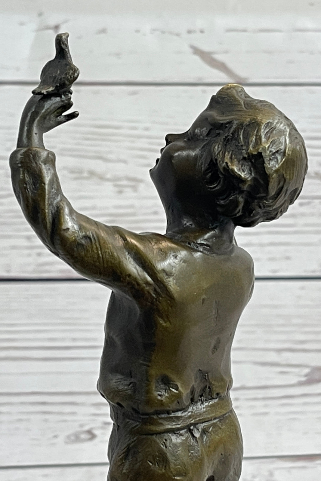Milo`s Artistry: Intricate Bronze Statue of a Boy Holding a Bird - Handmade by Miguel Lopez