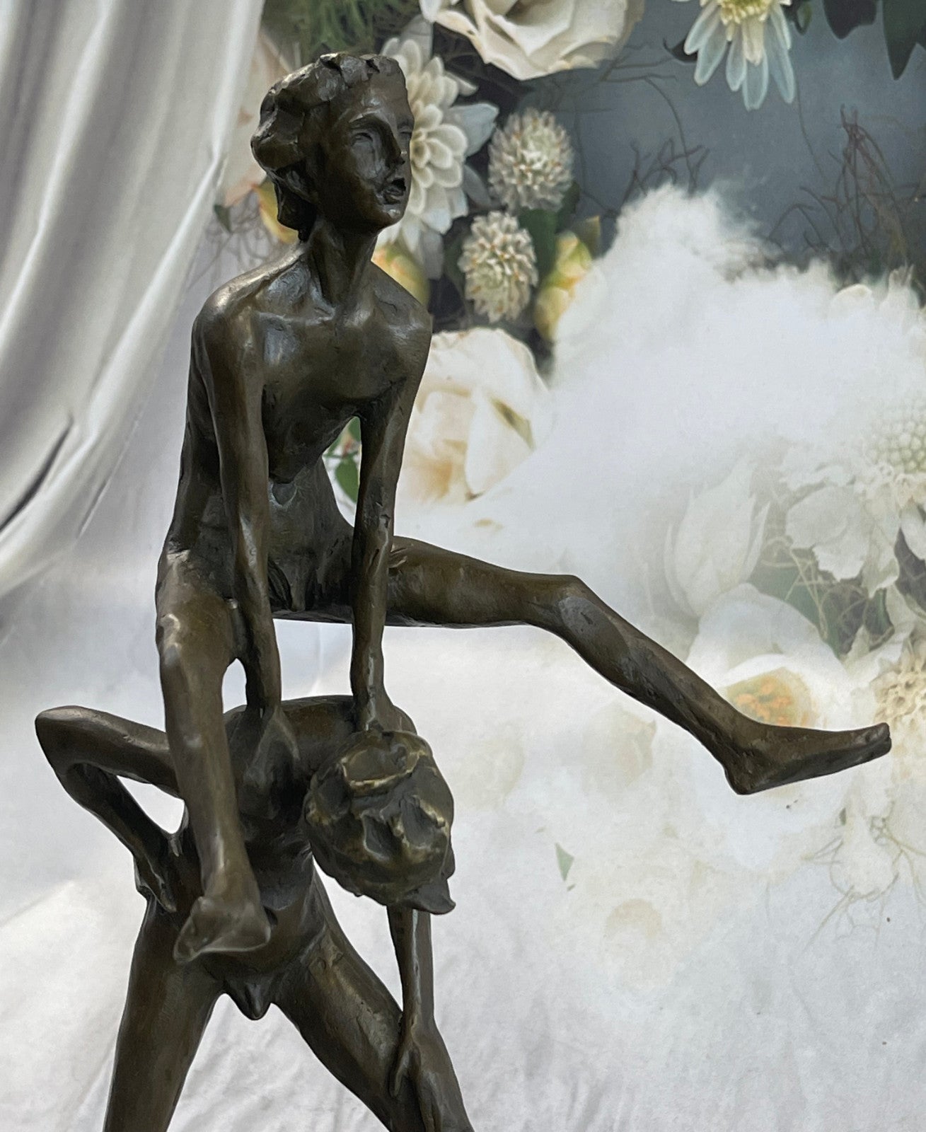 A bronze sculpture depicting two children playing leap-frog Home Decor Sale