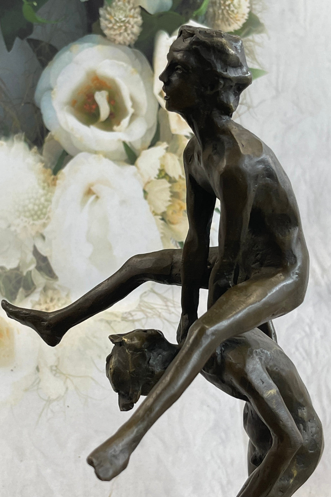 A bronze sculpture depicting two children playing leap-frog Home Decor Sale