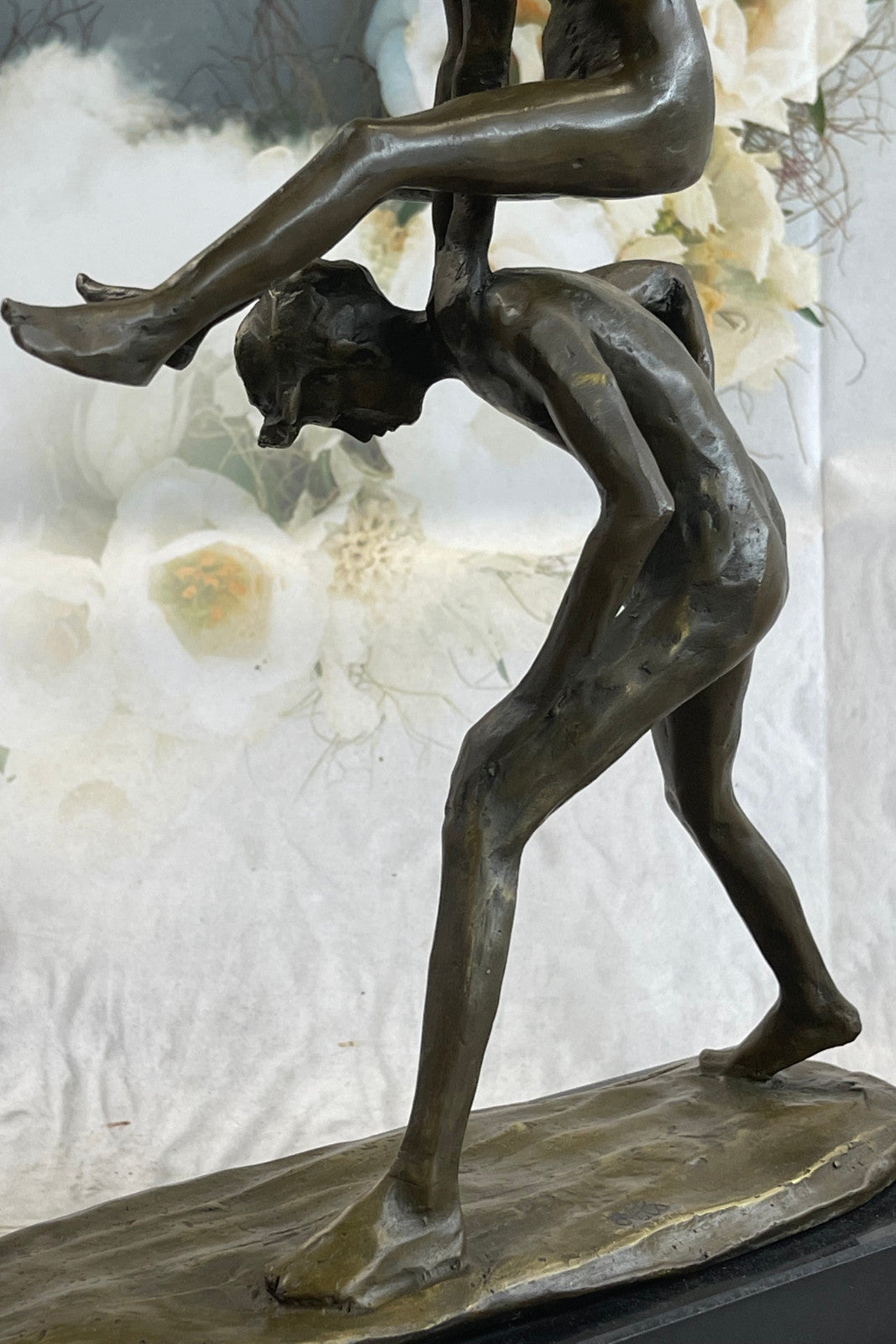 A bronze sculpture depicting two children playing leap-frog Home Decor Sale