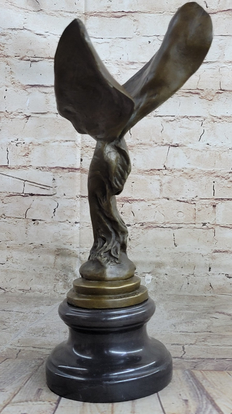 Spirit of Ecstasy Large bronze with brown patina mounted on dark marble base