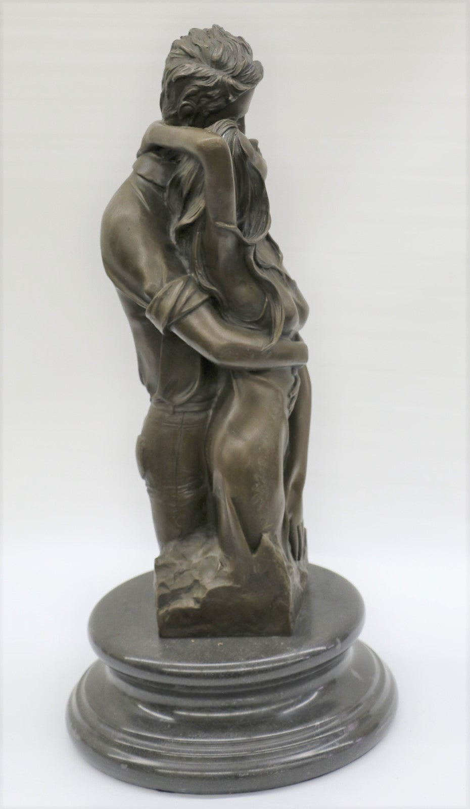 Bronze sculpture of a couple's tender embrace portrays the power of intimacy